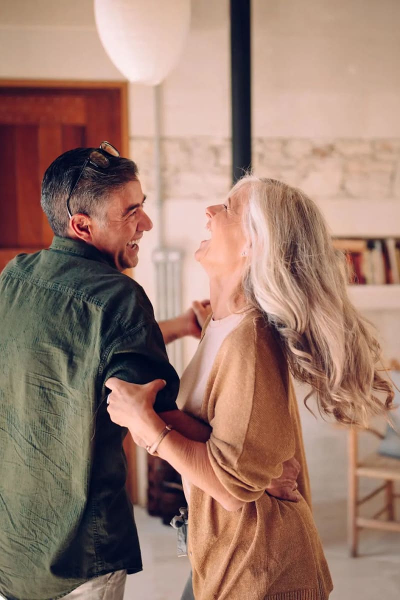 Resident couple dancing at Village on the Park Steeplechase in Houston, Texas