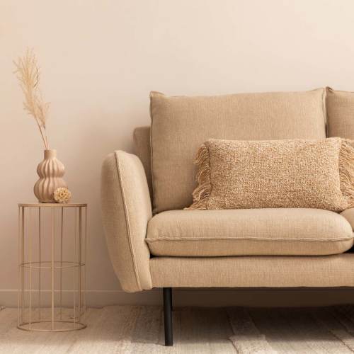 Couch with decor at Columbus School Limited Partnership in Baltimore, Maryland