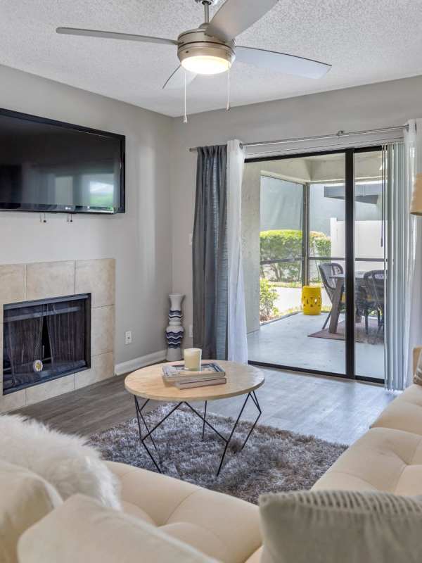 Spacious living room with fireplace at Stella Boca Raton Apartments, Boca Raton, Florida