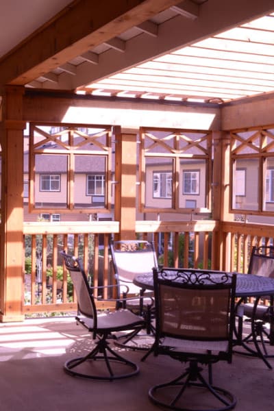 2nd floor balcony with tables and chairs at Quail Park of Lynnwood in Lynnwood, Washington