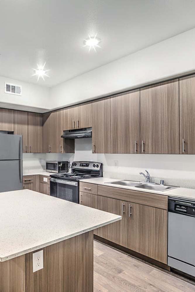 Kitchen with stainless-steel appliances at Melody in Las Vegas, Nevada