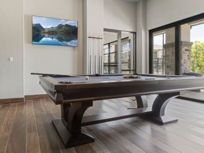 Pool table in the modern resident clubhouse at Auberge of Tyler in Tyler, Texas
