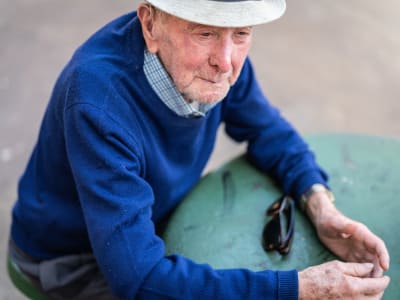 Resident wearing a hat resting at Randall Residence of West Milton in West Milton, Ohio