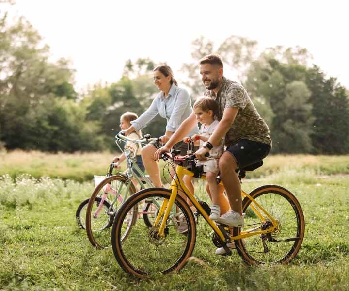 Resident family riding bikes with kids in the park near Mandolin Terrace in Nashville, Tennessee