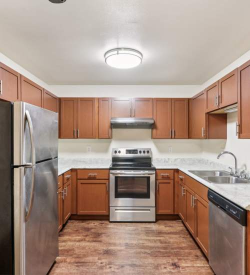 Kitchen with steel appliances at Woodfield Heights Apartments in Waukesha, Wisconsin