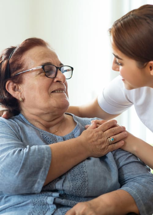 Staff member greeting a resident at Grand Villa of Altamonte Springs in Altamonte Springs, Florida