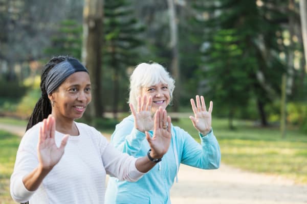Residents doing outdoor yoga at The Crossroads at Bon Air in Richmond, Virginia