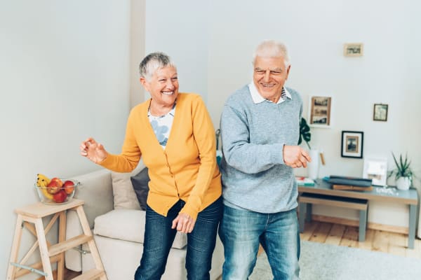 Two residents dancing in their living room at Heritage Senior Living in Blue Bell, Pennsylvania.