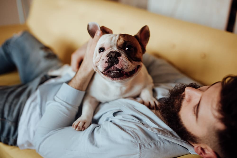 Resident playing with their pet at Cascade Ridge in Tacoma, Washington