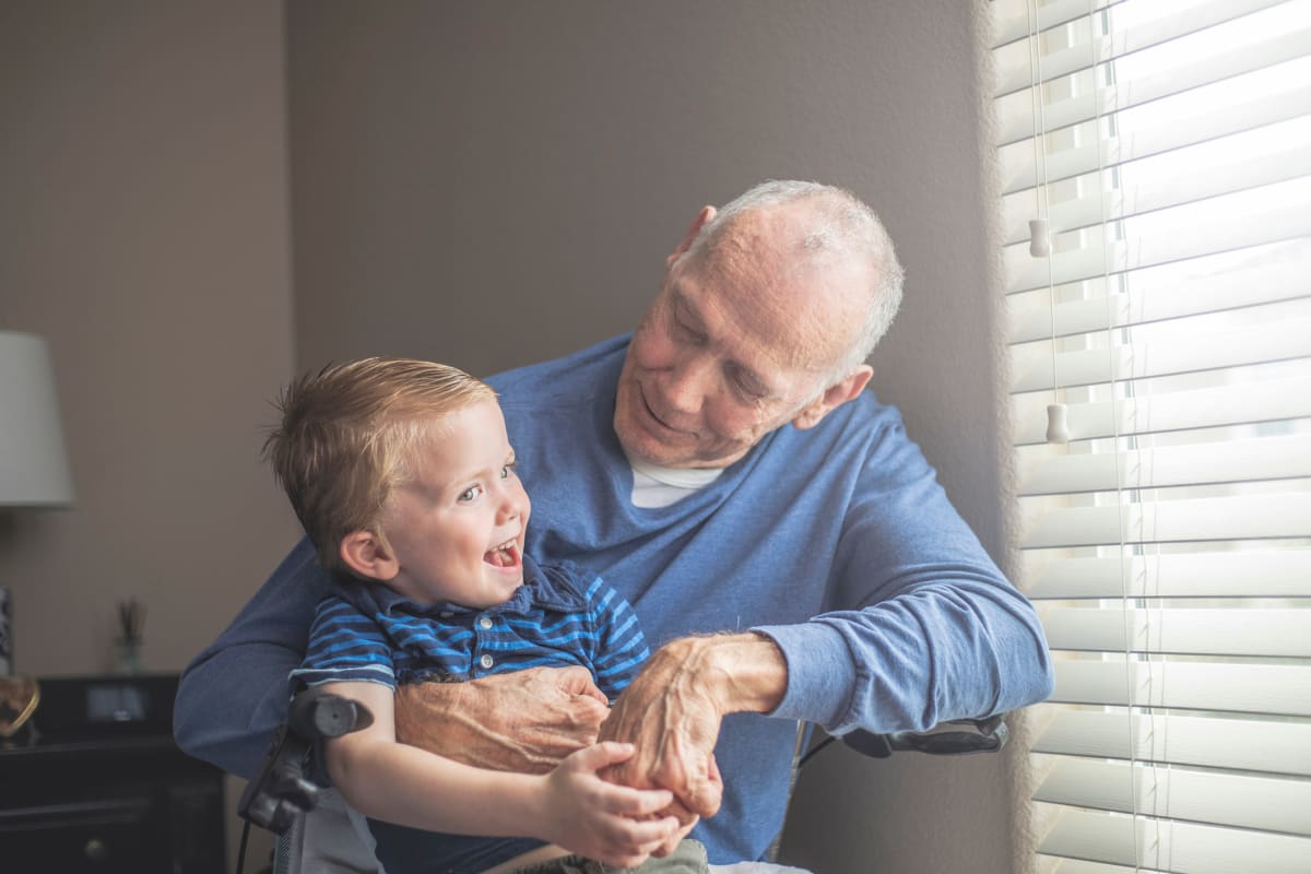 Child sitting on grandfather's lap at FountainBrook in Midwest City, Oklahoma