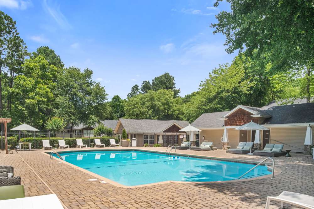 Swimming pool with view to community building at Preserve at Dunwoody in Dunwoody, Georgia