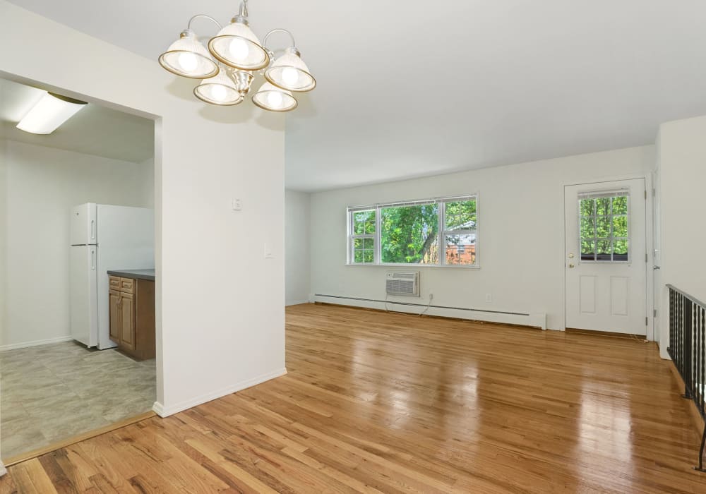 Spacious living room with wood style flooring at Nieuw Amsterdam Village in South Amboy, New Jersey