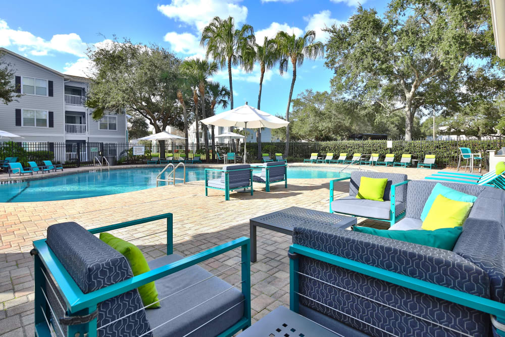 Outdoor lounge area near the pool at Amira at Westly in Tampa, Florida