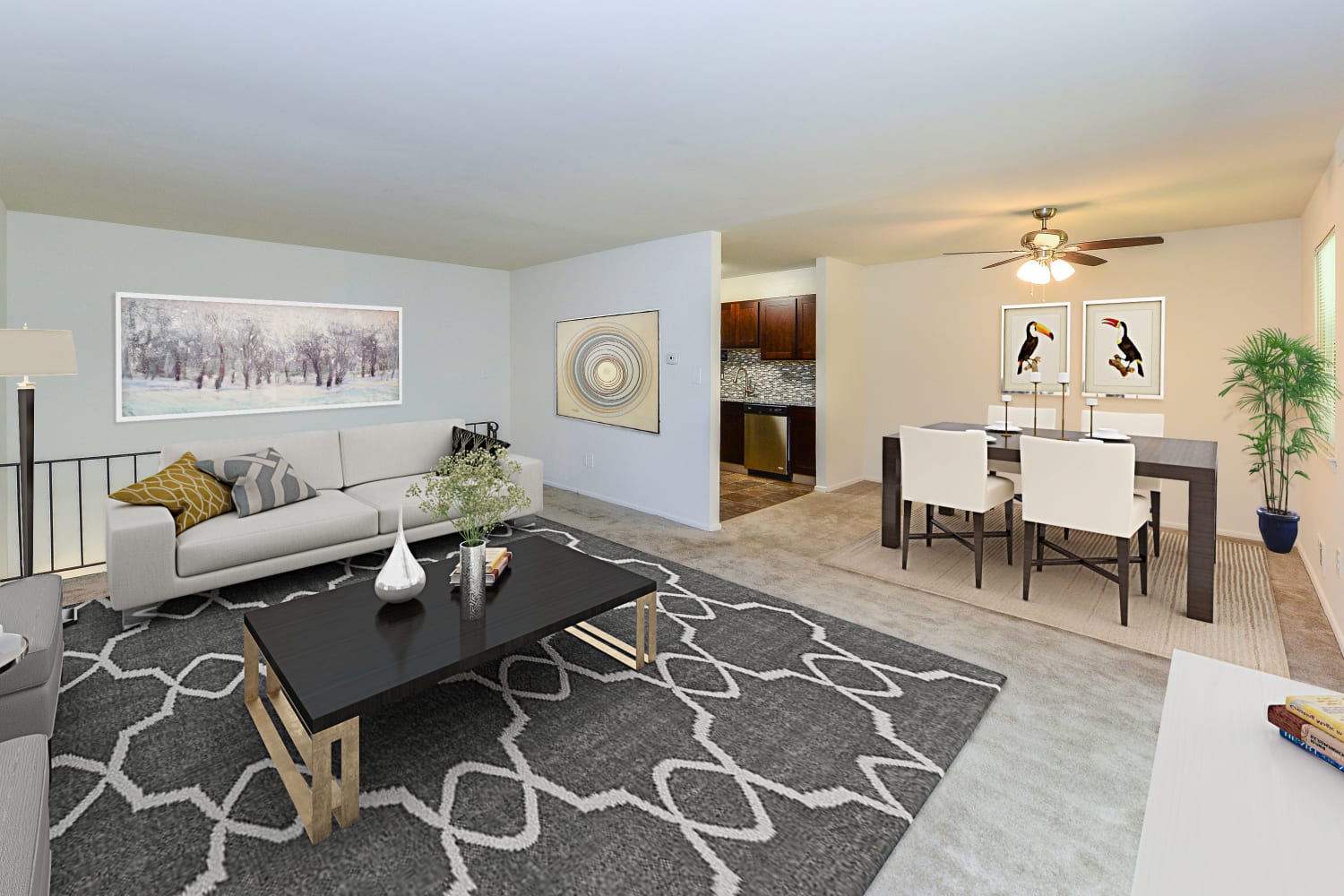 Open layout living room and dining area in a model home at Mt. Arlington Gardens Apartment Homes in Mt. Arlington, New Jersey