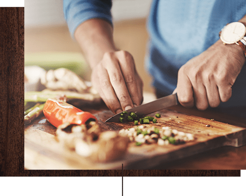 Resident cooking up something delicious in his new home's kitchen at Cameron Oaks Apartment Homes in Cameron Park, California