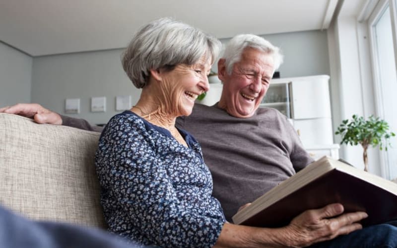 Couple reading at Grand Villa of DeLand in DeLand, Florida