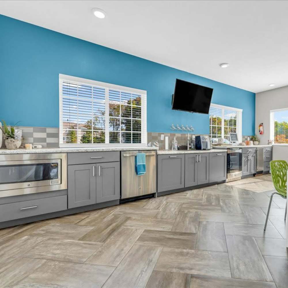 Spacious kitchen with wooden flooring at Timber View Apartments in Grand Haven, Michigan