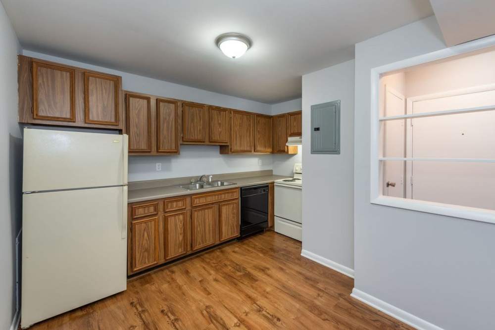Kitchen with large window and hard wood flooring at Signal Point Apartments in Mechanicsville, Virginia