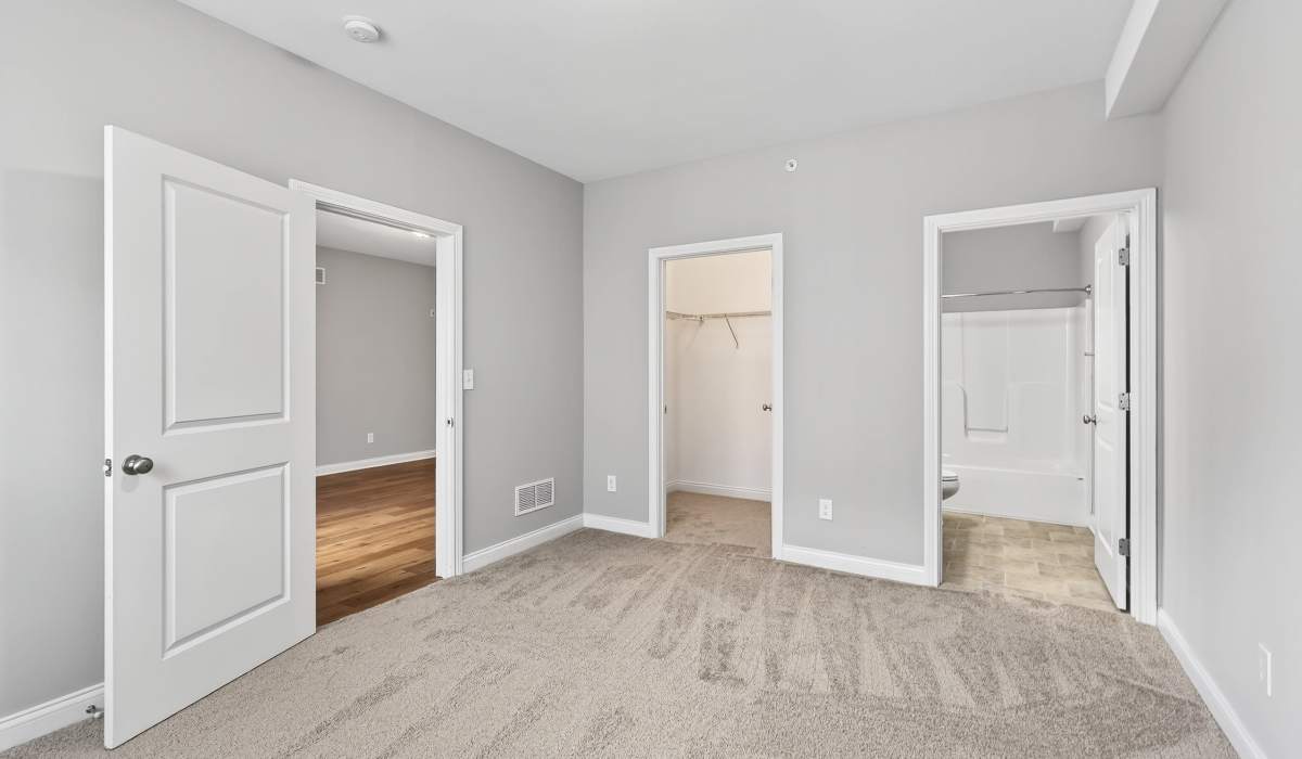 Master bedroom with access to closet and bathroom at Palomar View Apartments in Lexington, Kentucky