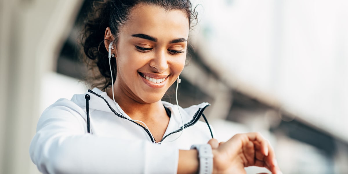 Resident setting smart watch while exercising at Marquis at Carmel Commons in Charlotte, North Carolina