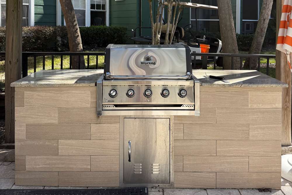 Outdoor grilling area at The Quarters Gainesville in Gainesville, Florida