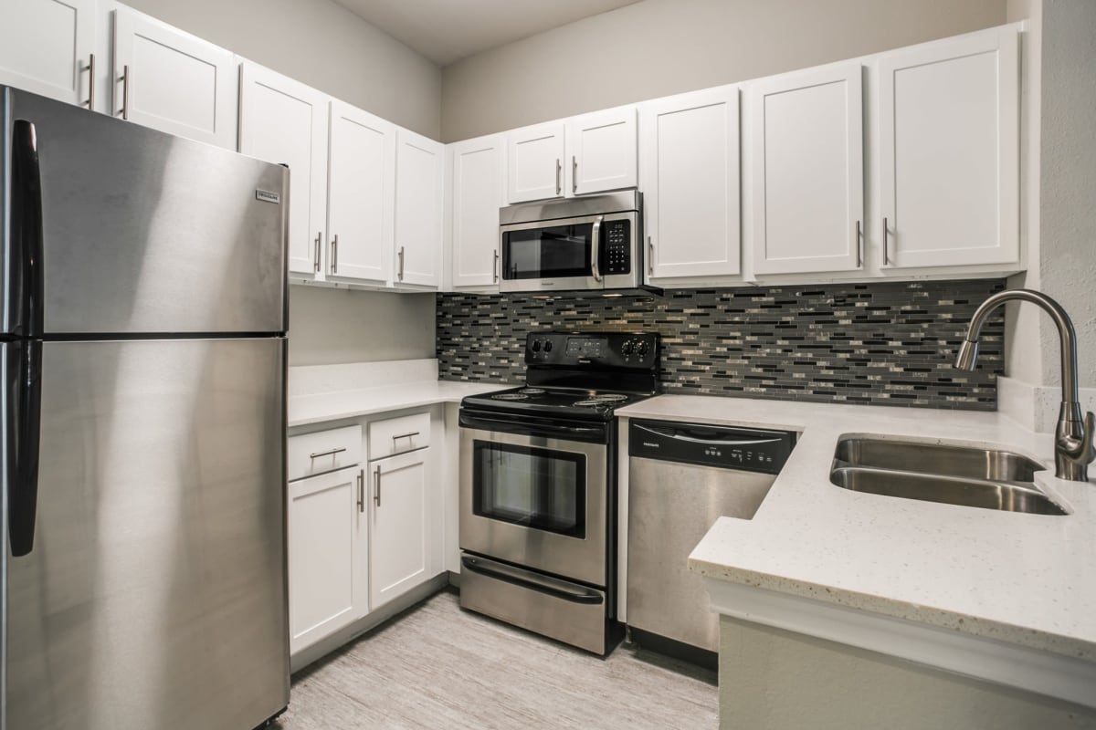Kitchen with stainless-steel appliances at The Maroneal, Houston, Texas