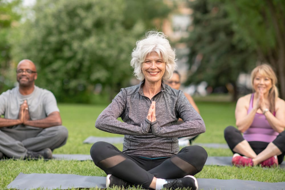 Resident doing yoga at Reserve at Round Rock in Round Rock, Texas