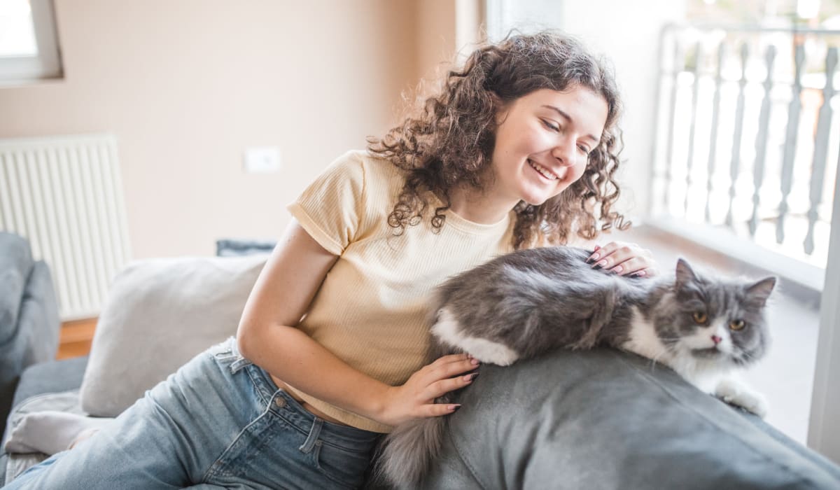 A resident and her cat in a home at Hamlet at MidCity in Huntsville, Alabama