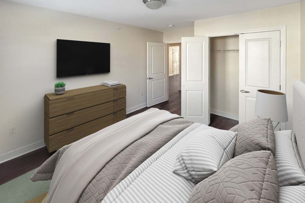 Quiet bedroom with dresser and TV at Stony Brook Village in Westford, Massachusetts