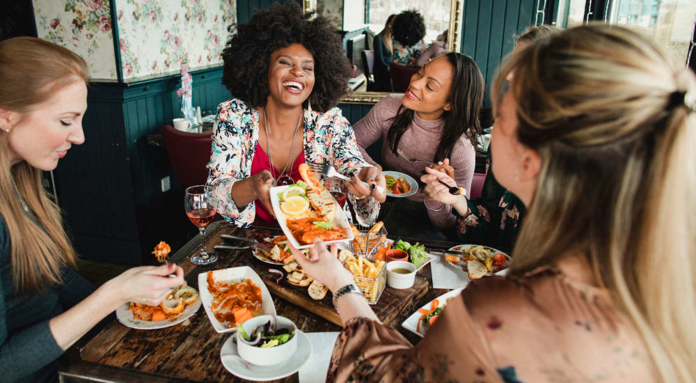 Residents enjoy a meal at their favorite spot near Crossroad Towers in Pittsburgh, Pennsylvania