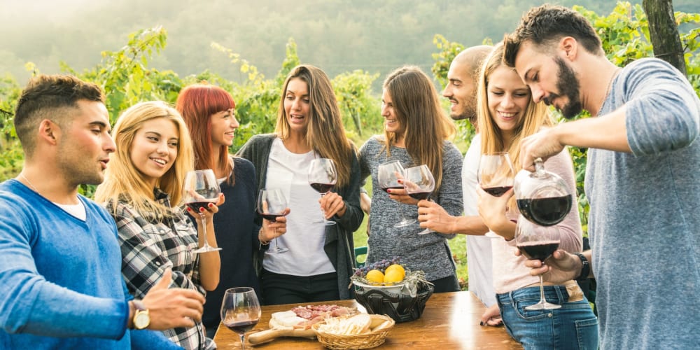 Friends having fun at a wine tasting event near Jackson Crossing in Alexandria, Virginia