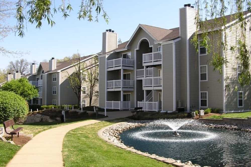 Apartment building with water fountain at Bonhomme Village in Olivette. MO