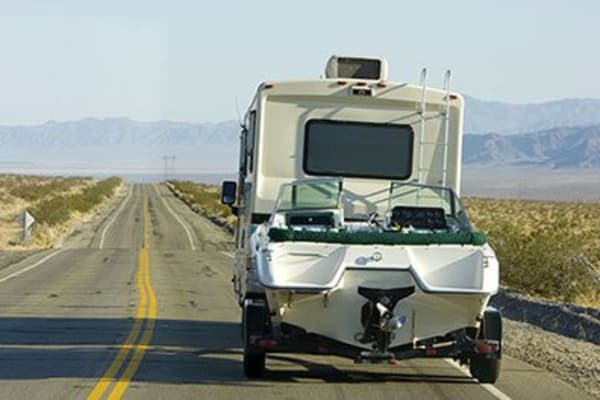 RV towing a boat near Fort Knox Self Storage in Montgomery, Alabama.