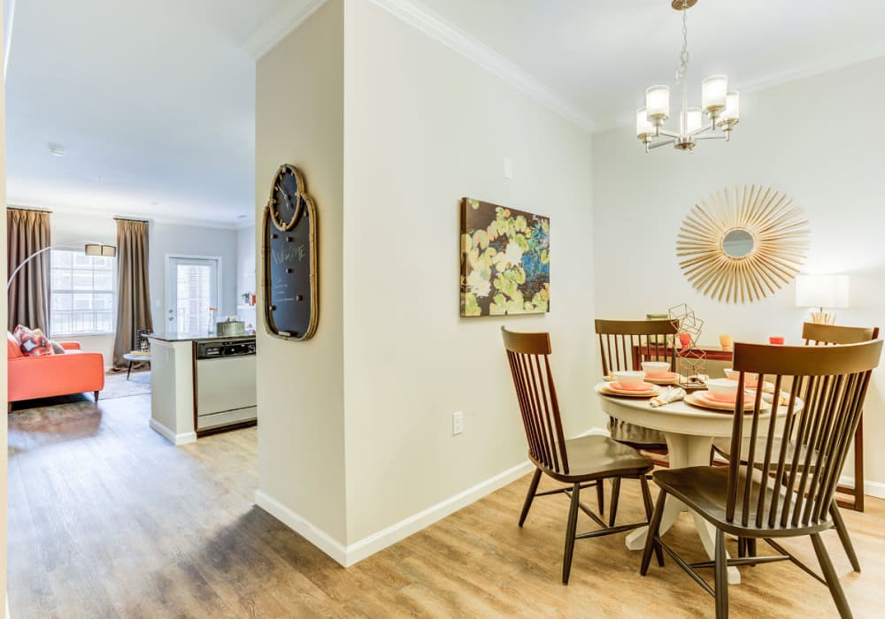 Open concept dining and living room at Bacarra Apartments in Raleigh, North Carolina