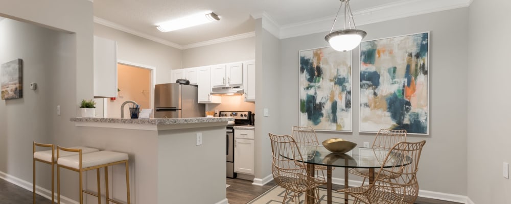 An apartment dining room and kitchen at Chace Lake Villas in Birmingham, Alabama 