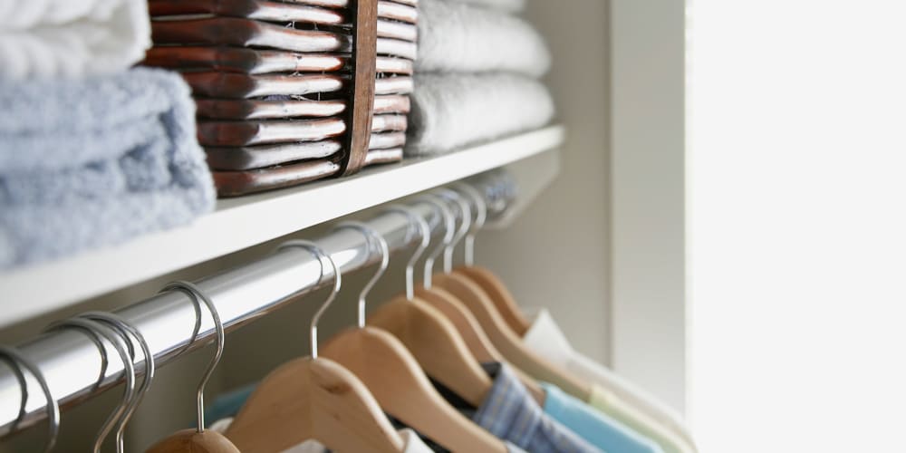 Clothes hanging in a closet at Mosby Bridge Street in Huntsville, Alabama