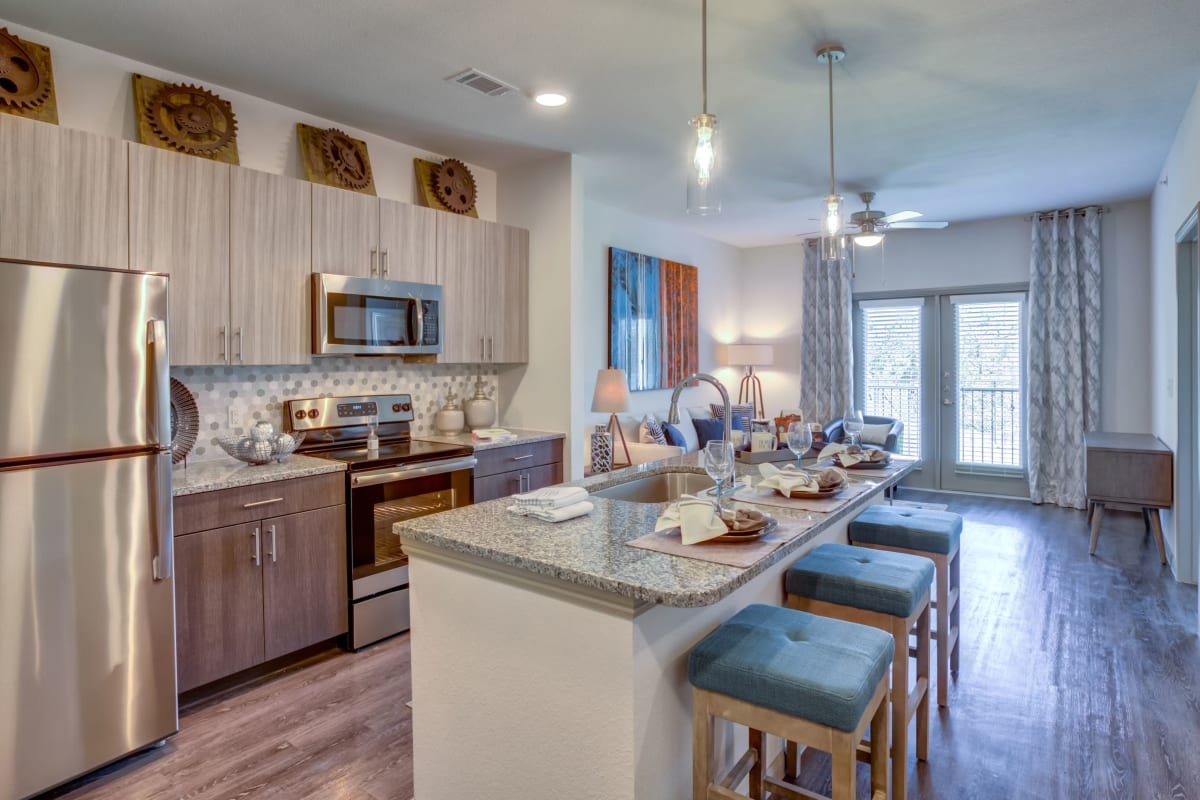 Kitchen with stainless-steel appliances at Williamson at the Overlook in Georgetown, Texas