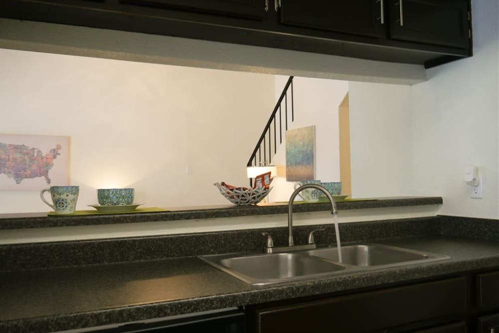 Kitchen view into living room at The Park at Ashford in Arlington, Texas