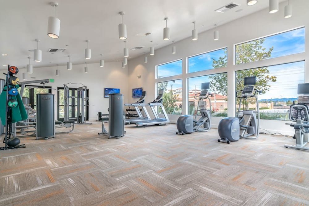 Big workout room full of modern equipment at Sycamore Canyons Apartments apartment homes in Riverside, California