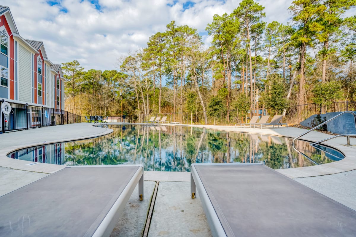 The resort-style pool at Huntsville Village Apartments in Huntsville, Texas