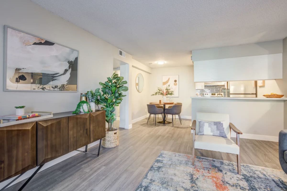 An apartment living room and kitchen at Ardella on 67th in Glendale, Arizona