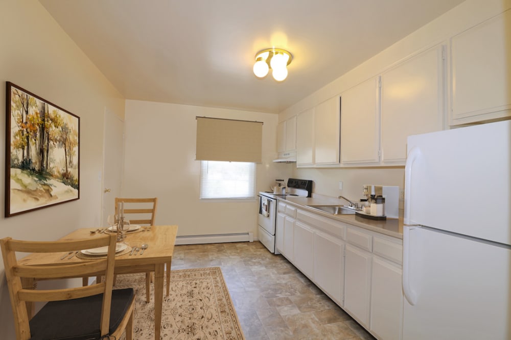 A front view of a kitchen with a hallway behind at Groton Estates in Groton, Connecticut