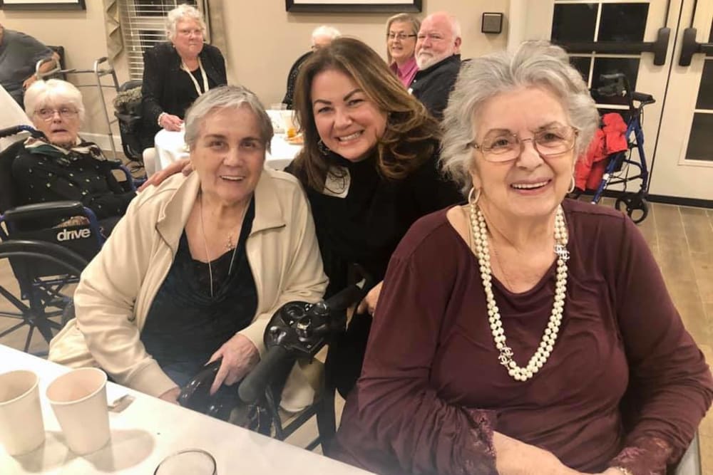 A group of residents and a staff member at an event at Inspired Living Lewisville in Lewisville, Texas. 