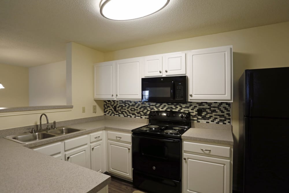 Apartment kitchen at Camellia Trace in Jackson, Tennessee