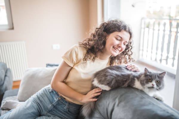 Happy cat and her owner in their new home at Hamlet at MidCity in Huntsville, Alabama