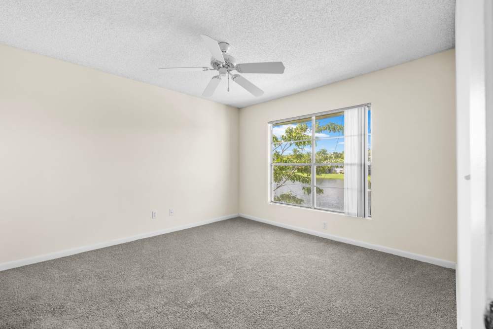 Bedroom with windows at El Cid Apartments in West Palm Beach, Florida