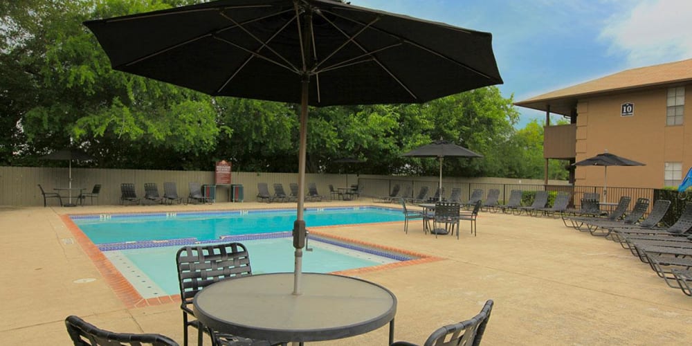 An apartment swimming pool and spa at The Granite at Tuscany Hills in San Antonio, Texas