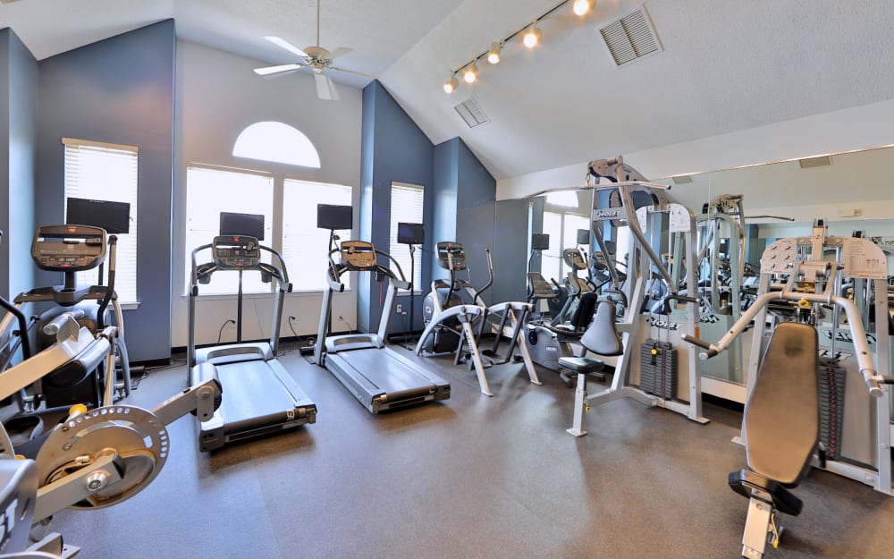 Well-equipped fitness center with cardio equipment at The Apartments at Diamond Ridge in Baltimore, Maryland
