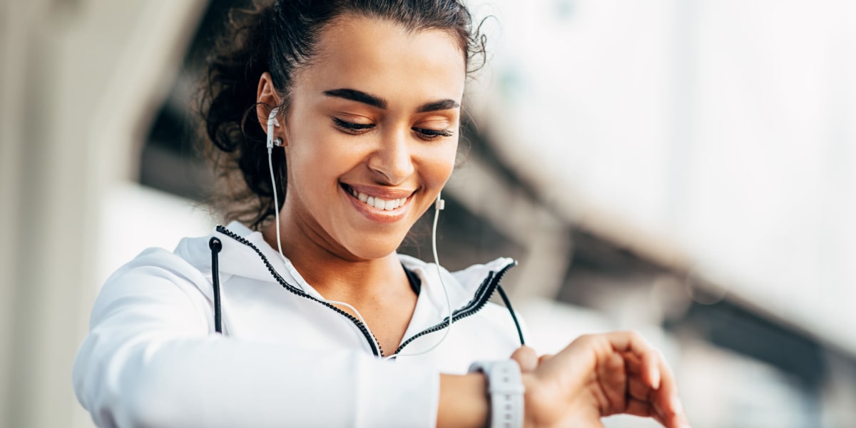 Resident setting her watch during fitness at Alante at the Islands in Chandler, Arizona