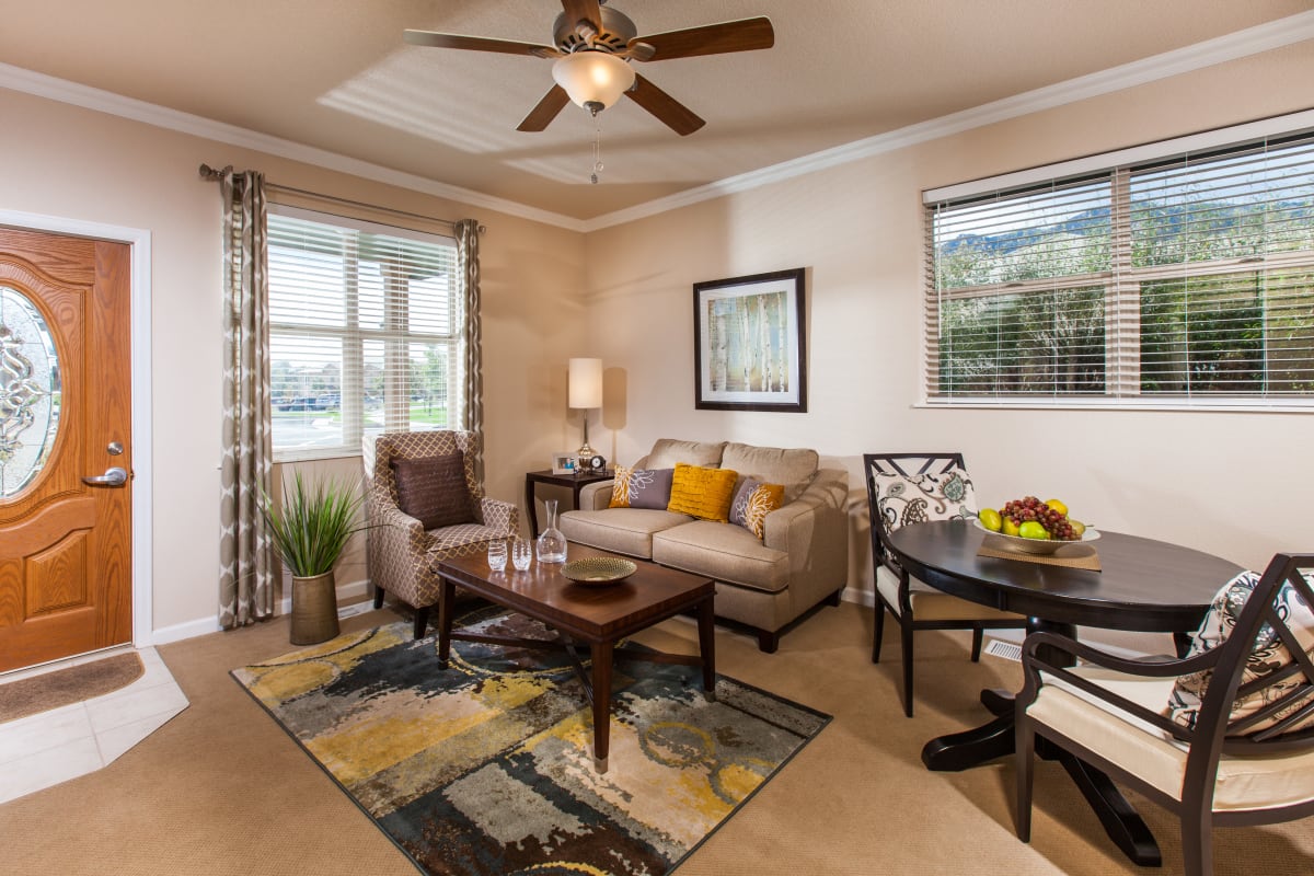 Resident apartment living room with furnishings at The Palisades at Broadmoor Park in Colorado Springs, Colorado